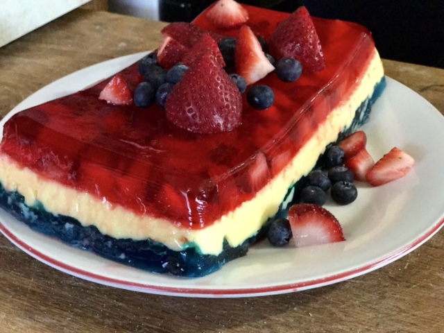 Red, white, and blue layered Jell-O dessert.