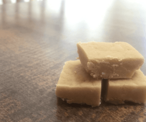 This easy peanut butter fudge recipe is made within minutes and will be a hit at your kitchen table. Click to grab this free recipe and read other time saving tips when making fudge. #ChristmasDesserts #Fudge #EasyRecipes