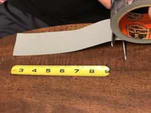 length of duck tape being cut