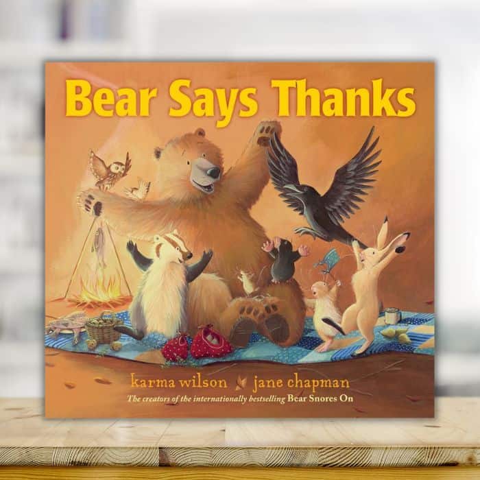 Bear says thanks book on shelf.