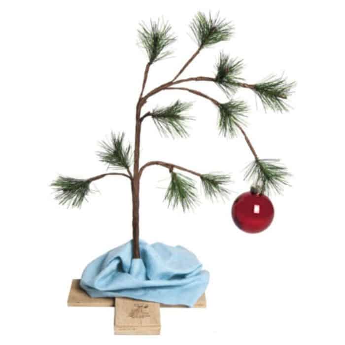Charlie Brown Christmas tree decoration with red Christmas ornament.