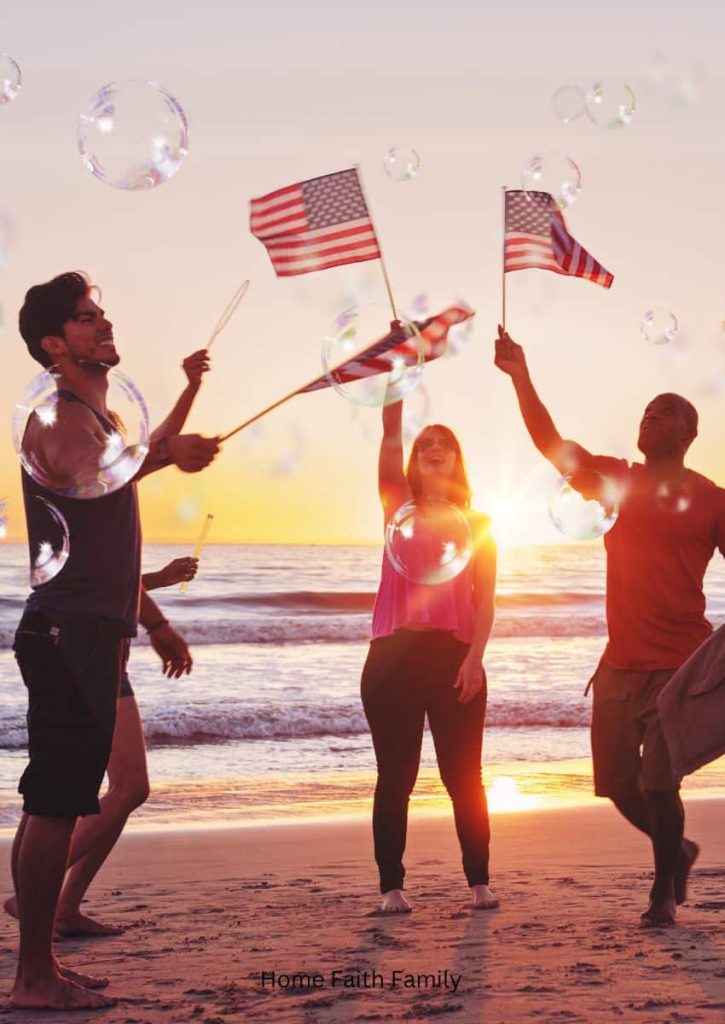 Couples on the beach waiving American flags and blowing bubbles.