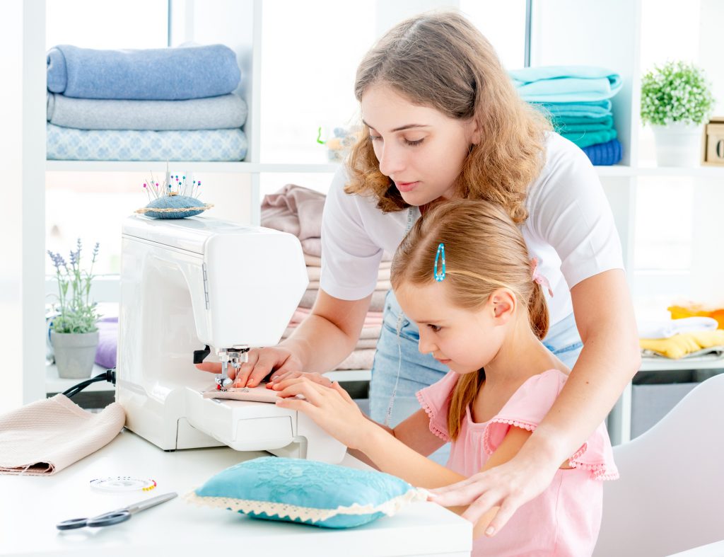 Everyone wants their children to grow up with a creative spirit and the skills necessary to do something they enjoy. Sewing is one of those hobbies that can be both fun and make for an excellent skill set. You may not know where to start when it comes to purchasing a sewing machine, or you might have some misconceptions about what types of machines are best for kids. In this article we will go over the best sewing machines for kids on the market today!