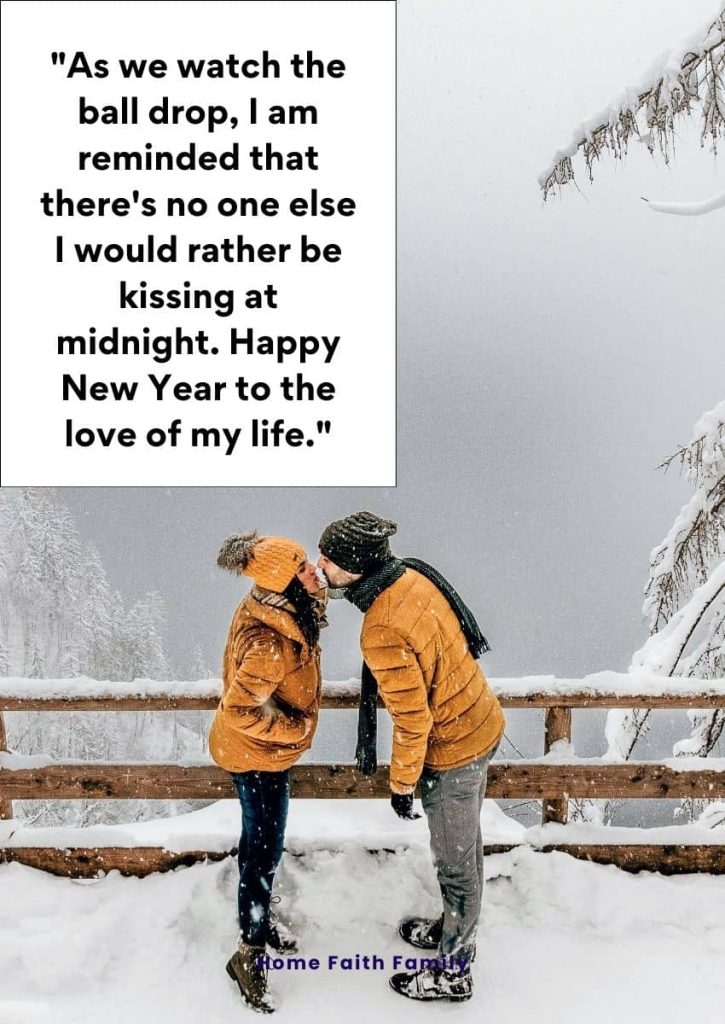 A couple kissing each other on a snow covered bridge.