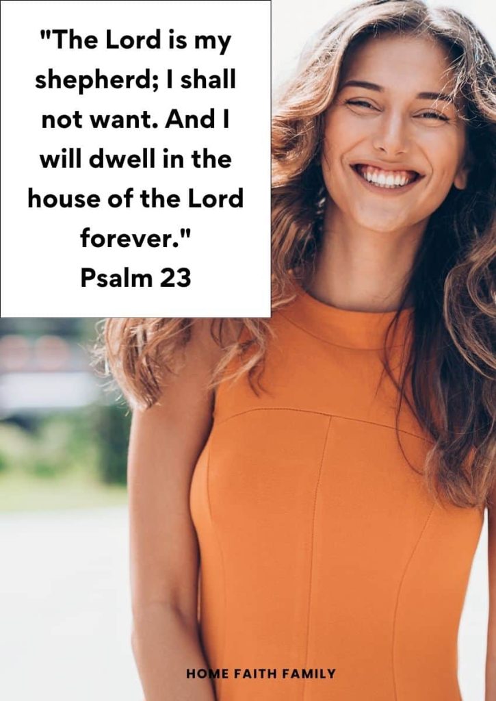 A woman in an orange dress is smiling and happy.