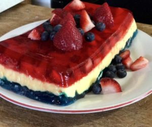 Red, white, and blue layered Jell-O dessert.