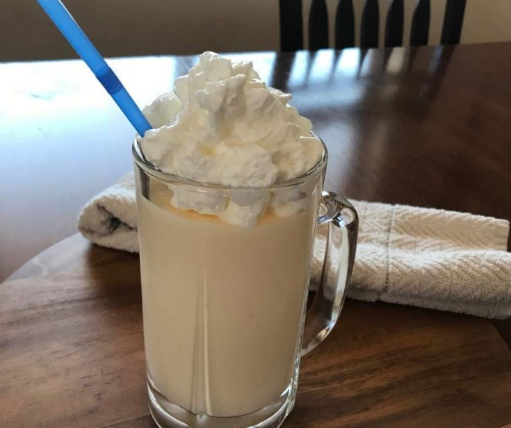 a cold copycat chick-fil-a frosted lemonade with whip cream.