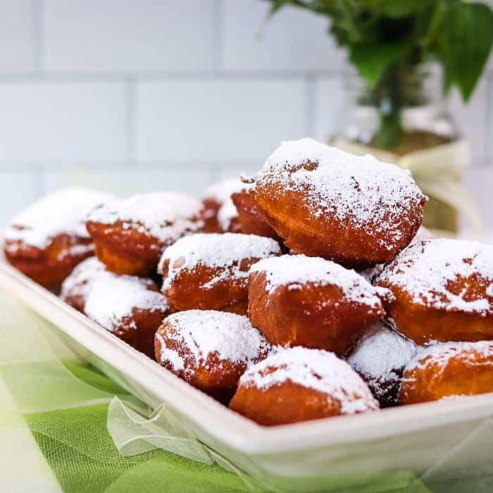 A plate full of fresh and famous beignets.