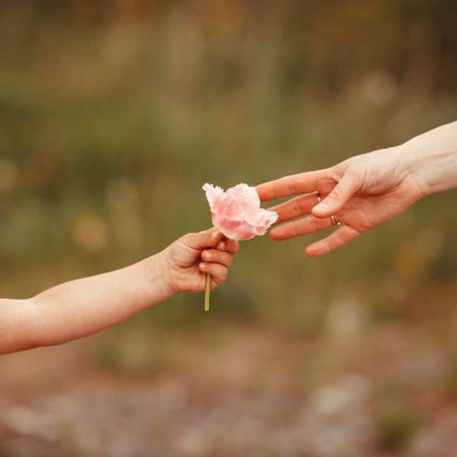 A child holding out a flower to their mother. What to say to a grieving mom.