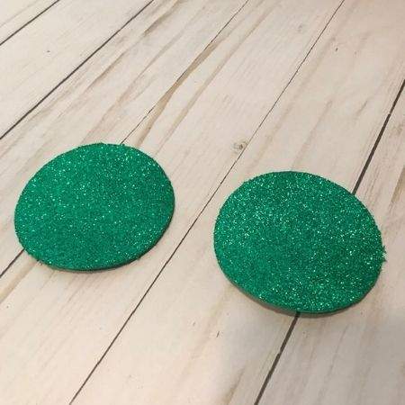 Round green glitter foam circles.