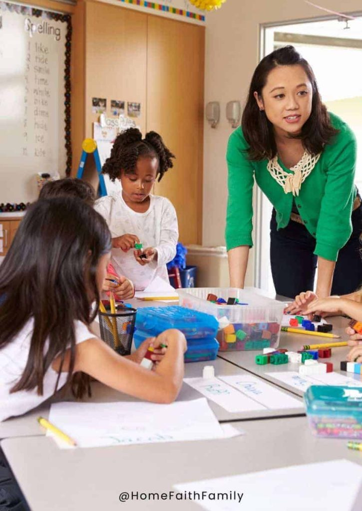 Preschool teacher visiting with students.