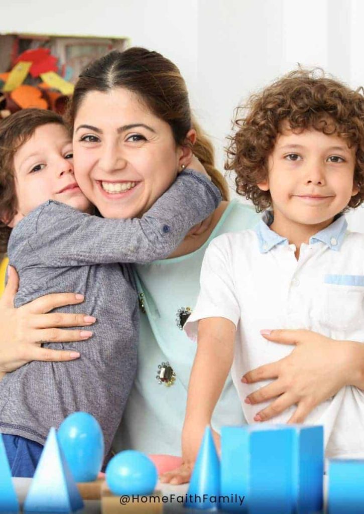 A daycare center worker being hugged by a preschooler.