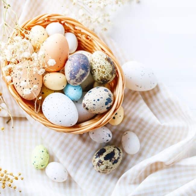 Easter verses for kids in a basket full of eggs.