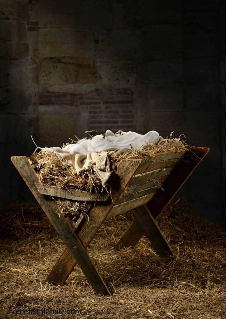 A manger with hay and cloth.