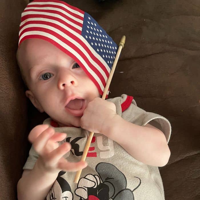 Baby with an American flag. Final thoughts for a stay at home mom routine.