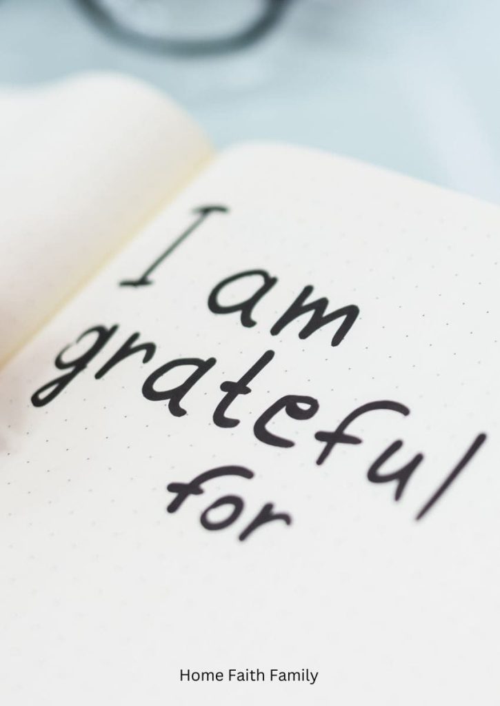 A notebook with the keywords "I am grateful for" on the pages.
