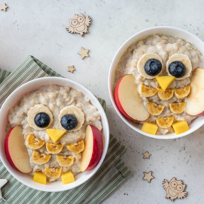 Delicious kids breakfast made into owls using fruit.
