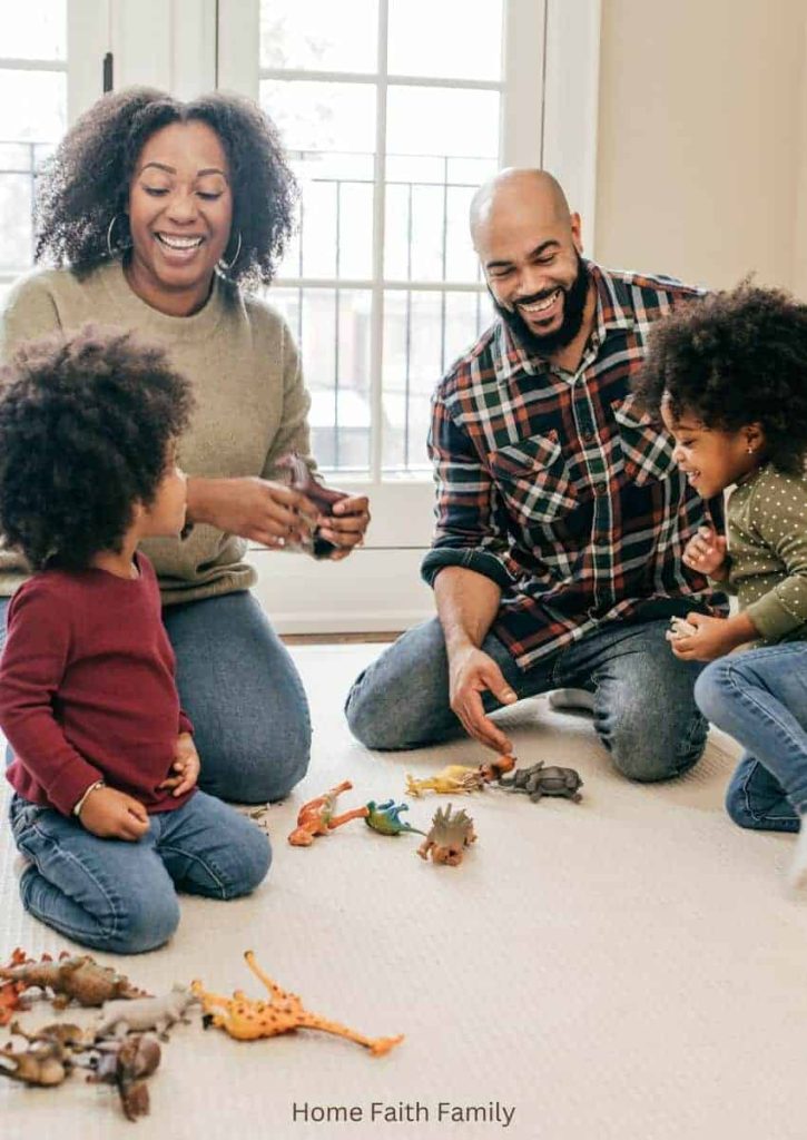 A family playing with toys on the ground.