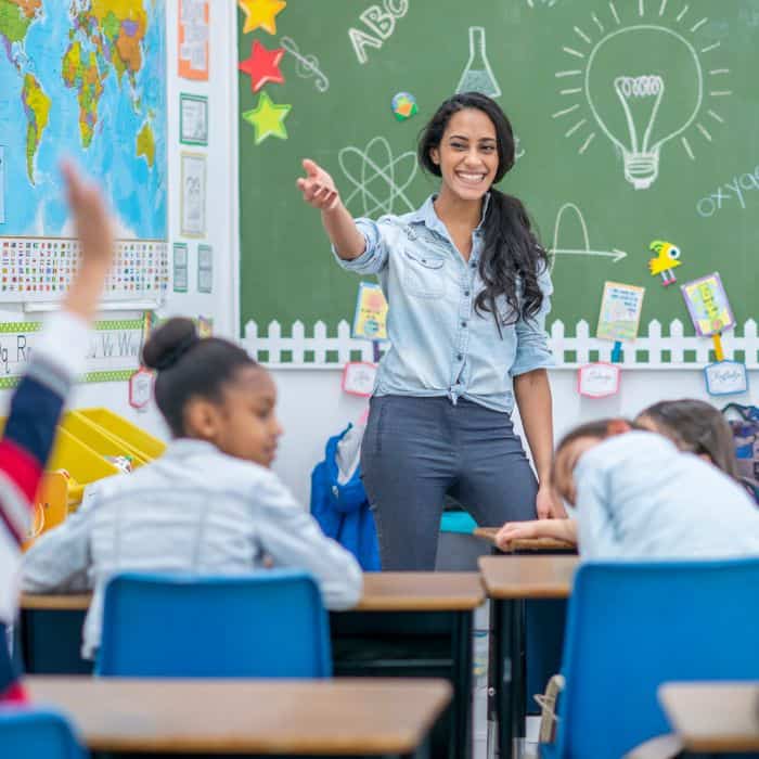 Public school teacher teaching her classroom.