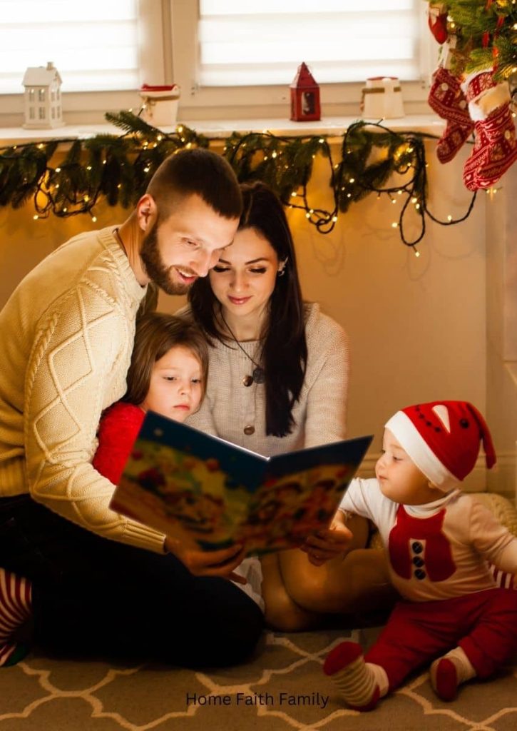 A family with small children dressed in red Christmas clothes are reading a book together.