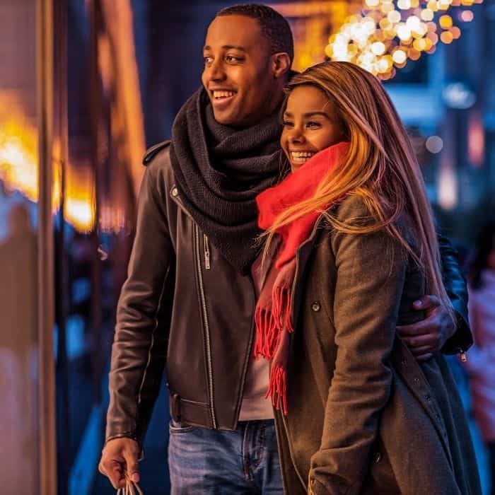 A couple in love going Christmas shopping.