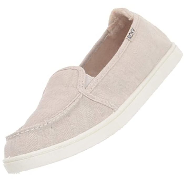 Cream colored slip on shoes for women.