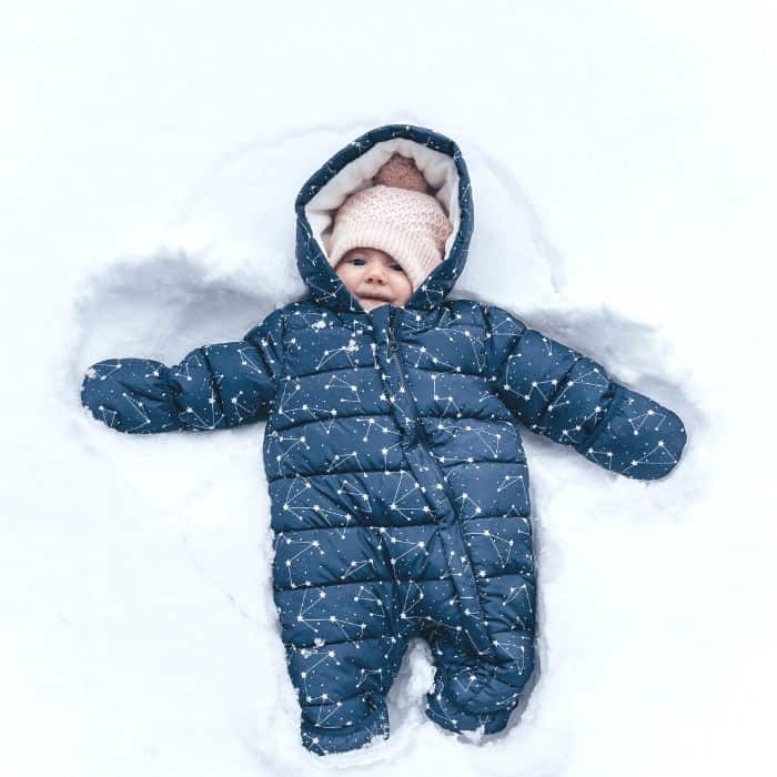 A baby in a snowsuit.