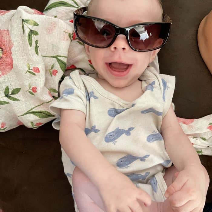 Baby wearing a pair of sunglasses. Stay at home mom SAHM FAQ.