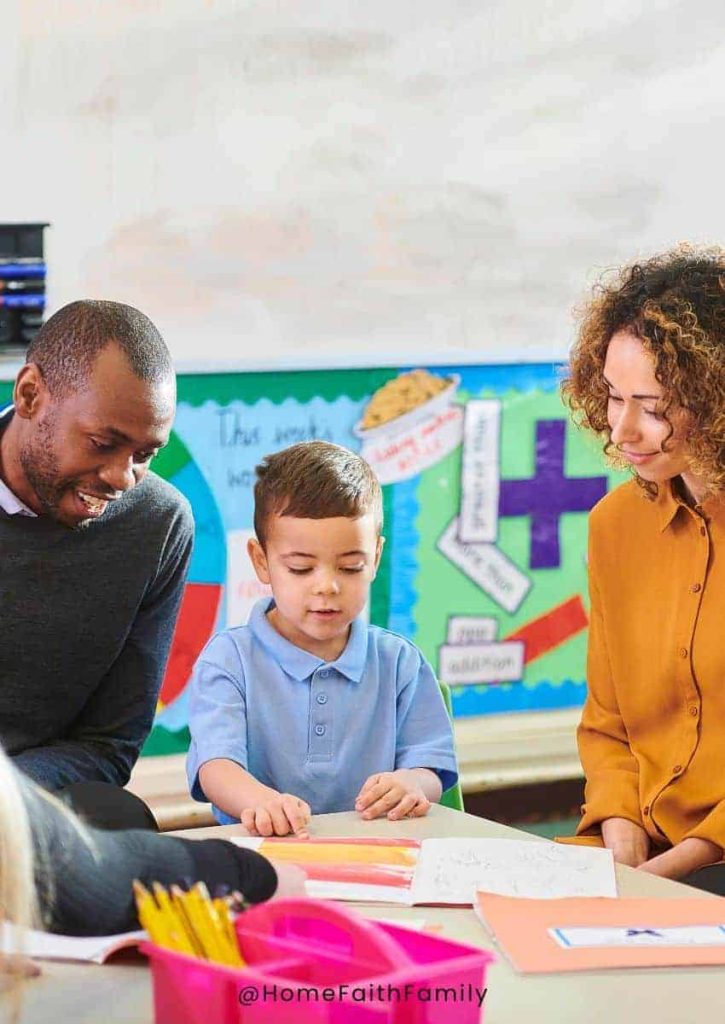 Preschool parents visiting with teacher.