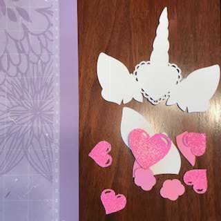 Unicorn pink glitter craft hearts.