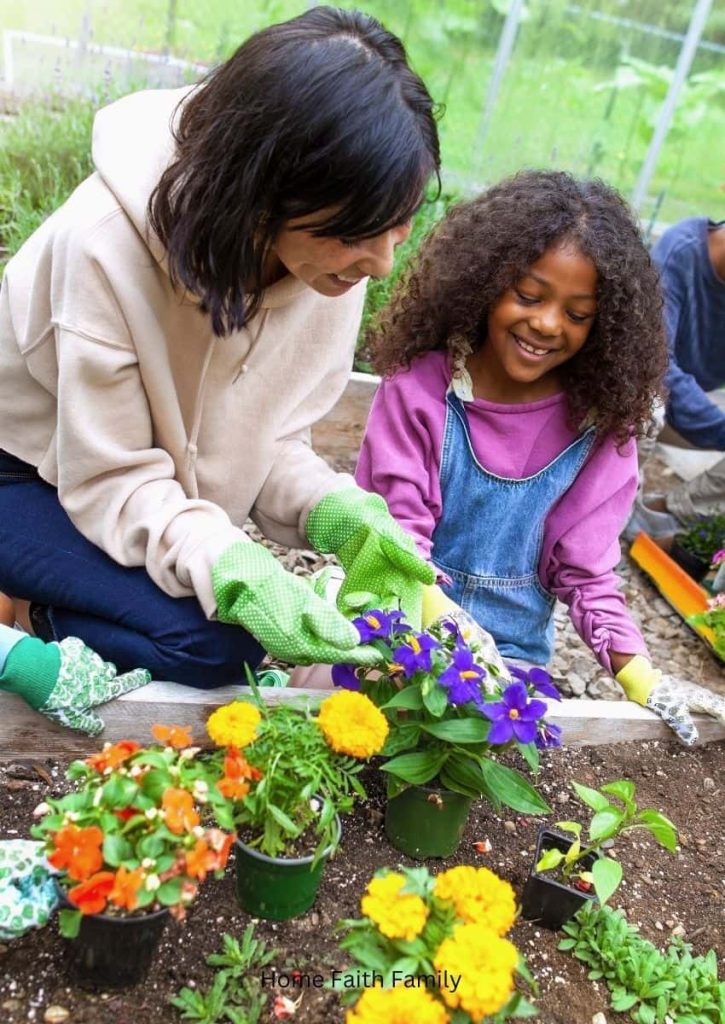 A mother and daughter working in a garden together.